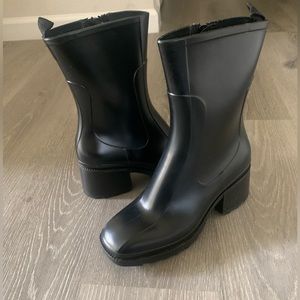 Pluis black rain boots by Jeffrey Campbell